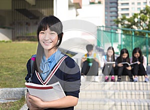 Girl Teenage StudentsÃÂ standing at campus